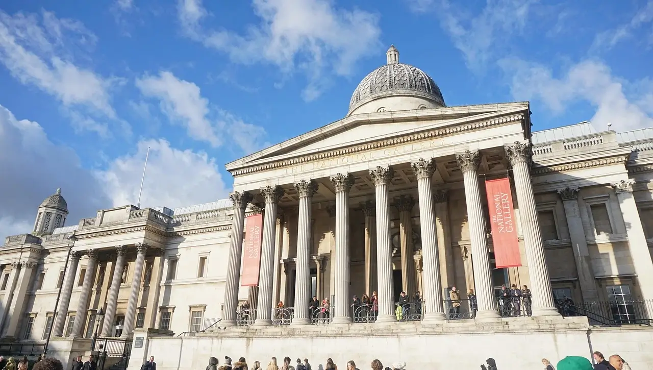 he National Gallery in London, with its grand neoclassical architecture and historic significance. Compare it with the Parisian Museum Louvre vs. National Gallery at yesversusno.net.