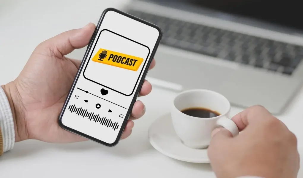 Listening to True Crime vs. Educational Podcasts on a phone with a cup of coffee, explore both worlds on yesversusno.net.