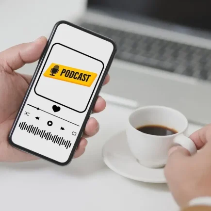 Listening to True Crime vs. Educational Podcasts on a phone with a cup of coffee, explore both worlds on yesversusno.net.