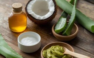 Natural skincare ingredients like aloe vera, coconut oil, and yogurt placed on a wooden table for a DIY skincare routine.