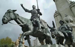 A grand statue of Don Quixote on horseback, illustrating his commitment to honor and ideals in Don Quixote Sayings, showcasing the conflict of yes vs no between belief and reality.