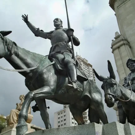 A grand statue of Don Quixote on horseback, illustrating his commitment to honor and ideals in Don Quixote Sayings, showcasing the conflict of yes vs no between belief and reality.